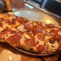 Lous Woodfire Pizza - Half shell meat lovers