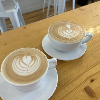 Union Coffee - Large hot latte in the foreground, lavender latte to the right. - Coffee & Tea Near Me - Greensboro, North Carolina Union Coffee - Large hot latte in the foreground, lavender latte to the right. - Coffee & Tea Near Me - Greensboro, North Carolina
