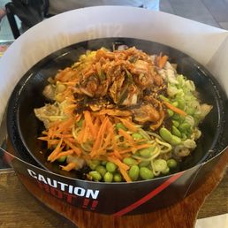 Sizzling plate with yakisoba, pork belly, and kimchi
