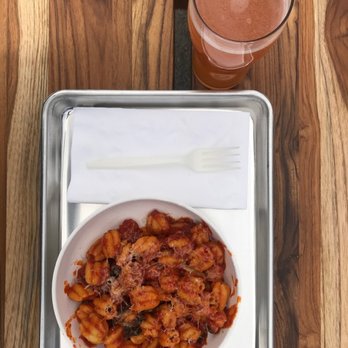 Tulipani - a plate of pasta and a glass of beer - Pasta Shops Near Me - Albuquerque, New Mexico