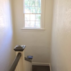 Dali Painting & Renovations - ATTENTION TO DETAIL: every bannister, spindle and window pane were painstakingly hand painted twice. Benjamin Moore: Linen, Deep Creek.