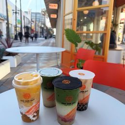 Champion Milk Tea, Pistachio Strawberry Matcha, Pistachio Iron Buddha Milk Tea, & Mango Island Forest