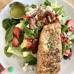 The Bistro at Blanco River - Salmon Gorgonzola Pecan Strawberry Salad with a fresh pesto vinaigrette dressing