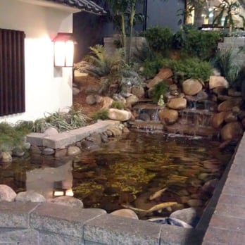 Kiku Japanese Steak House - The beautiful waterfall and rock garden outside of Kiku Japanese Steak House. - Japanese Near Me - Topeka, Kansas Kiku Japanese Steak House - The beautiful waterfall and rock garden outside of Kiku Japanese Steak House. - Japanese Near Me - Topeka, Kansas