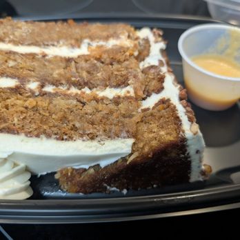 Stoney River - Hub's massive carrot cake with a sauce. - Steakhouses Near Me - Madison, Alabama Stoney River - Hub's massive carrot cake with a sauce. - Steakhouses Near Me - Madison, Alabama
