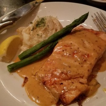 Kurt's Steakhouse - Salmon with dijon lobster sauce, asparagus and au gratin potatoes - Steakhouses Near Me - Delafield, Wisconsin Kurt's Steakhouse - Salmon with dijon lobster sauce, asparagus and au gratin potatoes - Steakhouses Near Me - Delafield, Wisconsin