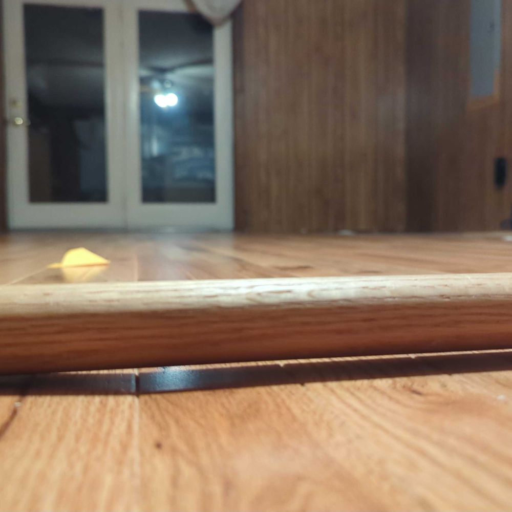 BPS Southeast Flooring - Oak dowel to show floor drop from ridge resulting from previous flooring install job. - Flooring Near Me - Rutherfordton, North Carolina BPS Southeast Flooring - Oak dowel to show floor drop from ridge resulting from previous flooring install job. - Flooring Near Me - Rutherfordton, North Carolina