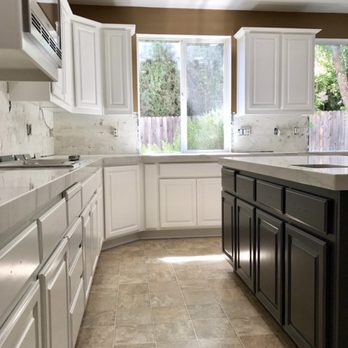 Paint Nation - Custom cabinets with an accent island - Painters Near Me
