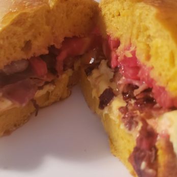 Bagels Plus - Bacon egg and cheese with tomato on an egg bagel - Bagels Near Me - Tampa, Florida