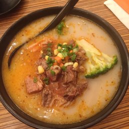 Spicy beef tendon & brisket with traditional ramen in pork broth