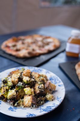 Photo of Serious Pie Downtown - Seattle, WA, US. Roasted brussels Caesar, Castelvetrano olives, focaccia croutons at Serious Pie - Downtown Seattle location