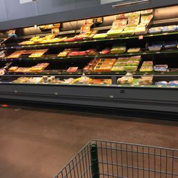 a shopping cart in a grocery store a shopping cart in a grocery store