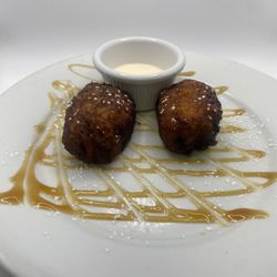 Sagche's Coffee House - Guatemalan rellenitos, smashed plantain filled with refried beans Guatemalan cream on side