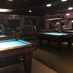 Wild Bill's Bar & Grill - 11 pool tables. And always friendly.  Food if you're hungry.