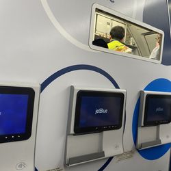 JetBlue - First row and no food trays or cup holders