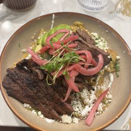 Chilaquiles with salsa verde and steak