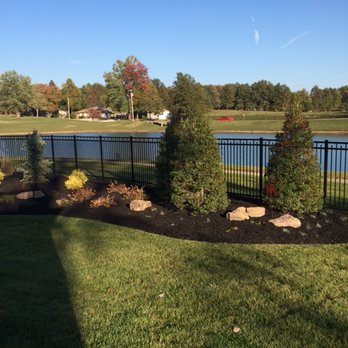 Second Nature - a view of a pond and a fence - Landscaping Near Me - Newburgh, Indiana