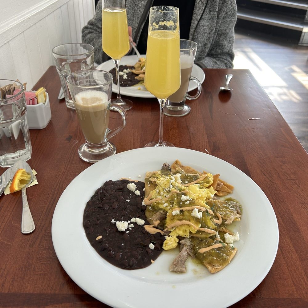 MayaFlor - Chilaquiles Verde with an orange mimosa and latte - Breakfast & Brunch Near Me - San Francisco, California MayaFlor - Chilaquiles Verde with an orange mimosa and latte - Breakfast & Brunch Near Me - San Francisco, California