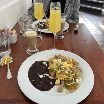MayaFlor - Chilaquiles Verde with an orange mimosa and latte - Breakfast & Brunch Near Me - San Francisco, California