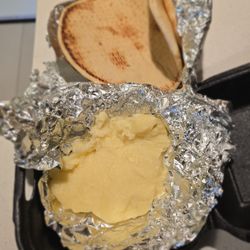 Zorba's Greek Cafe - This is supposed to be "Flaming Feta". It is not feta and there are no tomatoes, oregano, spiced peppers or olive oil.