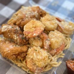 Garlic Shrimp and Chicken Wings over Garlic Noodles.