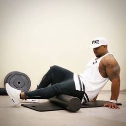House of AthletiX - Coach D.J. doing a little foam rolling before a workout