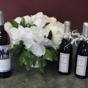 Winexpert - three bottles of wine and a vase of flowers - Beer, Wine & Spirits Near Me - Courtice, Ontario Winexpert - three bottles of wine and a vase of flowers - Beer, Wine & Spirits Near Me - Courtice, Ontario