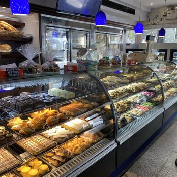 Fortunato Brothers - a display of pastries in a bakery - Desserts Near Me - Brooklyn, New York