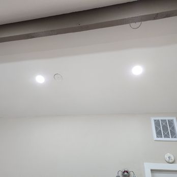 Eden Electric - Recessed lights in upstairs room. We were prepared for 9 holes since there's no attic access, but they managed 9 lights with just 2 holes. - Electricians Near Me - San Jose, California