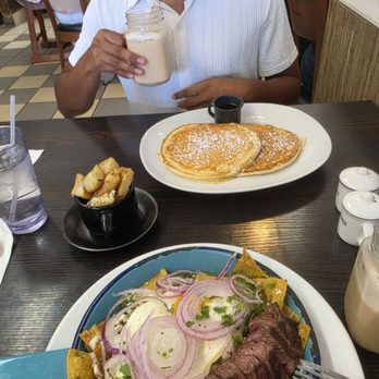 Cups Cafe - Buttermilk pancakes. Tomatillo sauce chilaquiles with steak. Side of potatoes in a cup. Horchata latte and caramel latte. - Breakfast & Brunch Near Me - Palm Desert, California