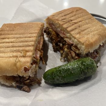 Las Tortas - a sandwich and a pickle on a plate - Mexican Near Me - Glendale, Colorado Las Tortas - a sandwich and a pickle on a plate - Mexican Near Me - Glendale, Colorado