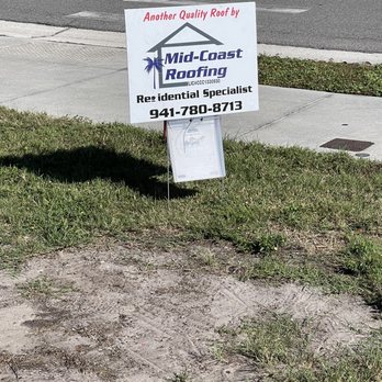 Mid-Coast Roofing - Sign advertising the company and box with needed paperwork inside. - Roofing Near Me - Lakewood Ranch, Florida