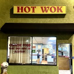 Hot Wok exterior facade with chef, waiter, owner small in the window interior