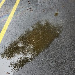 Oil all over the parking space where we were parked Oil all over the parking space where we were parked