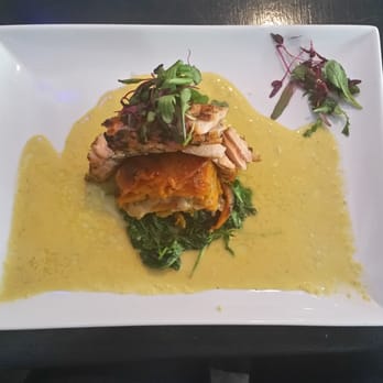 Waterfall Bar & Grille - The salmon special... salmon with sweet potato on a bed of arugula with a yellow pepper sauce. - American Near Me - Canton, Massachusetts