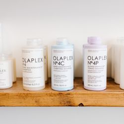 Devon Shae Beauty - Retail product shelf displaying Olaplex