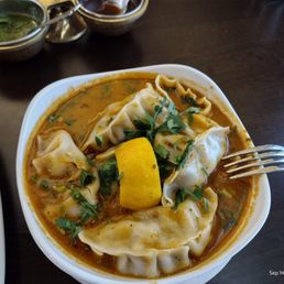 Jhol Momo (Steamed MoMo dunked in Sichuan pepper spiced roasted tomato sauce) Jhol Momo (Steamed MoMo dunked in Sichuan pepper spiced roasted tomato sauce)