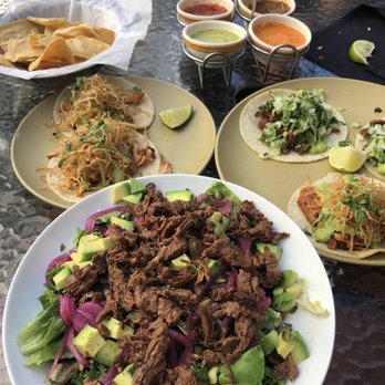 Machete Tequila + Tacos - Pollo Rostizado and Acapulco tacos with De La Casa Salad with steak - Mexican Near Me - Denver, Colorado Machete Tequila + Tacos - Pollo Rostizado and Acapulco tacos with De La Casa Salad with steak - Mexican Near Me - Denver, Colorado
