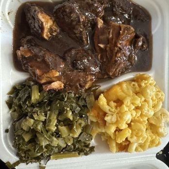 Leon's Caribbean Restaurant - Jerk Chicken with greens and mac and cheese - Caribbean Near Me - Pittsburgh, Pennsylvania