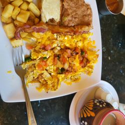 Casa Maria Mexican Restaurant - Migas with potatoes, beans and coffee.