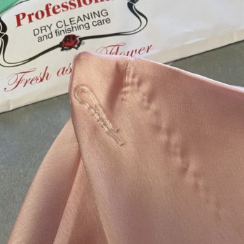 Plaza Dry Cleaners - Showing it's the clip that took out a thread from the skirt. - Dry Cleaning Near Me - Santa Monica, California Plaza Dry Cleaners - Showing it's the clip that took out a thread from the skirt. - Dry Cleaning Near Me - Santa Monica, California