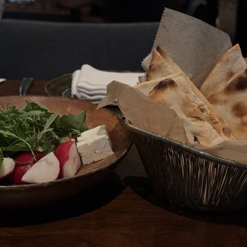 Rumi’s Kitchen - Plate of fresh greens and a basket of baked on-site Taftoon bread - Persian/Iranian Near Me - Washington, DC, District of Columbia