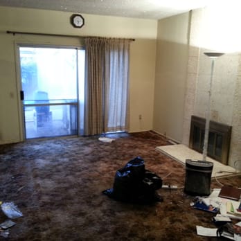 Dynamic Construction Group - Living room before - General Contractors Near Me
