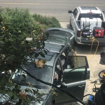 Clean Slate Mobile Wash - The team at work detailing the inside of my car, right in my driveway - Auto Detailing Near Me