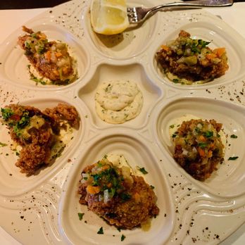 Woodmont Grill - Oysters ($20 as of 8/2023). It's five fried oysters with what Woodmont terms "cowboy vinaigrette" on top and a sauce underneath. - New American Near Me - Bethesda, Maryland Woodmont Grill - Oysters ($20 as of 8/2023). It's five fried oysters with what Woodmont terms "cowboy vinaigrette" on top and a sauce underneath. - New American Near Me - Bethesda, Maryland