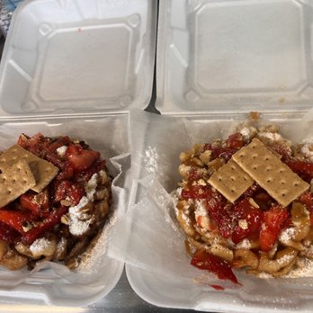 Carmel Coated Concessions - Custom Funnel Cakes - one with caramel, one with chocolate. Both with strawberries and graham crackers and joy - Desserts Near Me - Columbus, Ohio