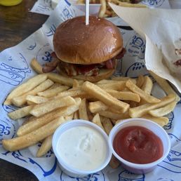 Sofi Burger and Bacon Cheeseburger with a side of fries, guava barbecue sauce and aioli sauce., Sofi Burger and Bacon Cheeseburger with a side of fries, guava barbecue sauce and aioli sauce.,