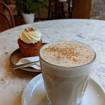 companion coffee - Chai latte w/ oat milk and an olive oil carrot cake cupcake - Cafes Near Me - Berlin, BE
