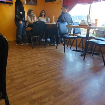 Los Primos Cafe - Girl on the right came in without mask but rest of group is compliant. - Mexican Near Me - Galveston, Texas