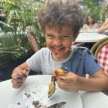 Cannelle - Nutella croissant and a happy boy - Coffee & Tea Near Me - Ann Arbor, Michigan